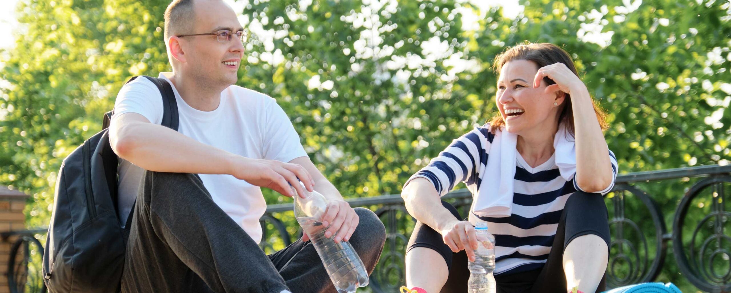 middle aged couple sittng outdoors