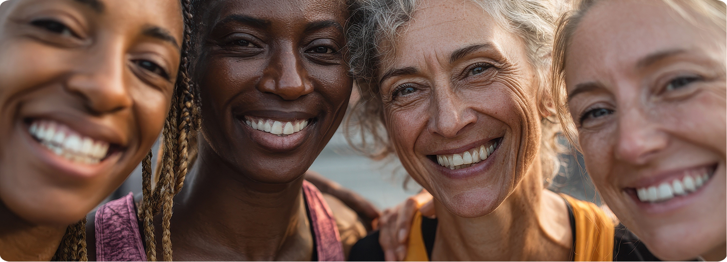 Diverse group of women over 40 smiling together, reflecting energy, vitality, and healthy aging during midlife.
